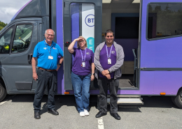 Our installer Tim with two members of the BT Digital voice team in front of their bus outside Morrisons in Fakenham.
